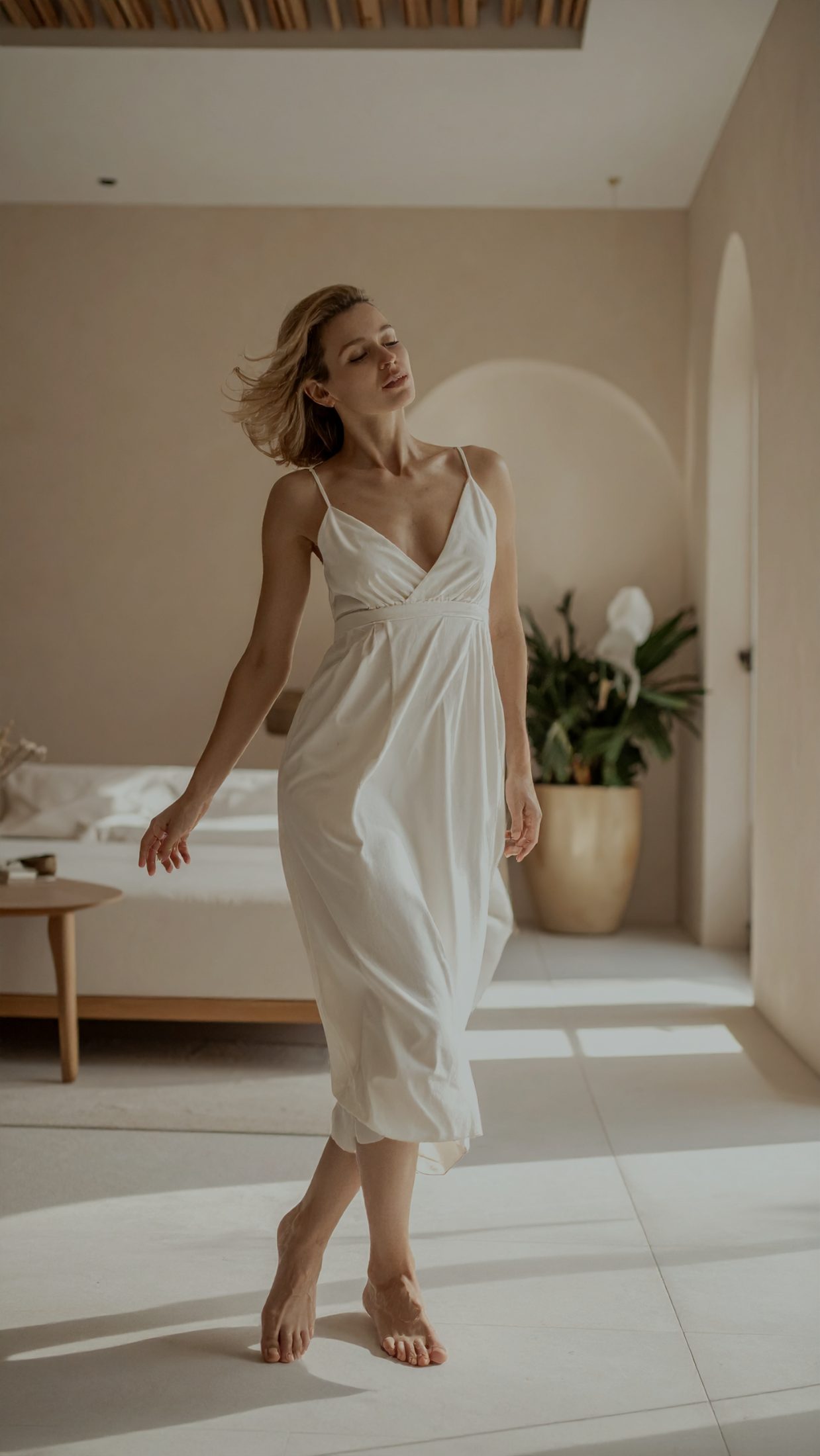 A dancer turning in low warm light